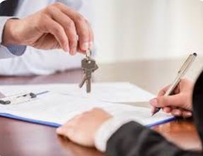 Title agent handing keys to homebuyers after signing closing documents in Citrus County Florida