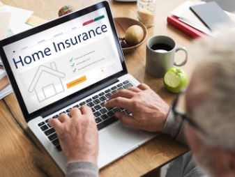 Senior man researching home insurance and PMI on a laptop while preparing to buy a home in Citrus County Florida.